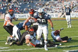 Running back Mike McLeod ’09 steps into the end zone, leaving a slew of Princeton defenders in his wake during the Bulldogs’ 34-31 loss to the Tigers on Saturday. Even McLeod’s four rushing touchdowns during the first half could not save the Elis from ignominious defeat.